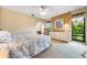 Relaxing bedroom with light-colored walls, plush carpeting, and bright natural light at 3530 Wilkinson Woods Dr # 14, Sarasota, FL 34231
