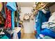 Organized walk-in closet featuring shelving and hanging storage, offering ample space for clothes and accessories at 3530 Wilkinson Woods Dr # 14, Sarasota, FL 34231
