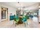 Dining area featuring modern furniture, a mirrored wall that visually expands the space, and easy access to the living area at 3530 Wilkinson Woods Dr # 14, Sarasota, FL 34231