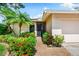 Inviting front entrance with tropical landscaping, creating a warm welcome to the cozy single Gathering home at 3530 Wilkinson Woods Dr # 14, Sarasota, FL 34231