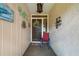 Welcoming front porch featuring stylish décor and a cozy seating area, creating a charming entrance to the home at 3530 Wilkinson Woods Dr # 14, Sarasota, FL 34231