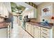 Charming kitchen features light colored cabinets, decorative backsplash, and stainless steel appliances at 3530 Wilkinson Woods Dr # 14, Sarasota, FL 34231