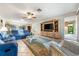 Spacious living room with comfortable seating, a ceiling fan, and an open layout that connects to other living spaces at 3530 Wilkinson Woods Dr # 14, Sarasota, FL 34231