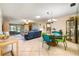Open-concept living and dining area with a combination of tile flooring and neutral walls that provide a light and airy feel at 3530 Wilkinson Woods Dr # 14, Sarasota, FL 34231