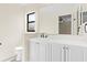 Well-lit bathroom with a vanity and a window offering plenty of natural light at 3551 65Th Avenue E Cir, Sarasota, FL 34243