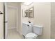 This bathroom features a sink, a toilet, and a tile floor at 3551 65Th Avenue E Cir, Sarasota, FL 34243