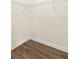 A walk-in closet featuring wire shelving, wood-look flooring, and ample storage space at 3551 65Th Avenue E Cir, Sarasota, FL 34243