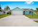 Charming home with blue siding, white trim, and a two-car garage at 3551 65Th Avenue E Cir, Sarasota, FL 34243
