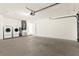 This garage features a washer, a dryer, and access to the home at 3551 65Th Avenue E Cir, Sarasota, FL 34243