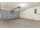 This garage has a gray door and an automatic opener at 3551 65Th Avenue E Cir, Sarasota, FL 34243