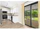Beautiful kitchen featuring modern appliances, granite countertops, and sliding glass doors to the backyard at 3551 65Th Avenue E Cir, Sarasota, FL 34243