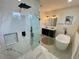 Tasteful primary bathroom showcasing glass shower, double vanity and modern fixtures for a spa-like feel at 3616 Bellefonte Ave, North Port, FL 34286