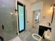 Elegant bathroom with a glass-enclosed shower, modern vanity, and stylish finishes at 3616 Bellefonte Ave, North Port, FL 34286