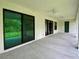 Covered patio with ceiling fans provides an ideal outdoor relaxation spot at 3616 Bellefonte Ave, North Port, FL 34286
