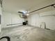 Large garage with an automatic door and lots of open space for vehicles and storage at 3616 Bellefonte Ave, North Port, FL 34286