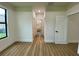 Hallway featuring wood-look flooring and multiple doorways to other rooms at 3616 Bellefonte Ave, North Port, FL 34286