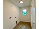 Bright laundry room featuring modern fixtures and ample space for appliances at 3616 Bellefonte Ave, North Port, FL 34286