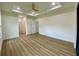 Large main bedroom featuring wood-look flooring and multiple doorways to other rooms at 3616 Bellefonte Ave, North Port, FL 34286