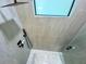 Close-up of a modern shower with sleek fixtures and a skylight at 3616 Bellefonte Ave, North Port, FL 34286