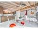 Bright dining area with exposed beams, modern furniture, and a view into a modern living space at 3636 Mineola, Sarasota, FL 34239