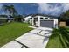 Modern home with well-manicured lawn, stylish driveway, and attached garage for contemporary living at 3636 Mineola, Sarasota, FL 34239