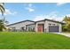 Beautiful modern home with a well-manicured lawn and sleek architectural design at 3636 Mineola, Sarasota, FL 34239