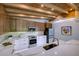 Modern kitchen featuring white cabinets, stainless steel appliances, a mosaic backsplash, and wooden ceiling beams at 3636 Mineola, Sarasota, FL 34239