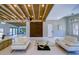 Spacious living room with modern furniture, white walls, and wooden ceiling beams at 3636 Mineola, Sarasota, FL 34239