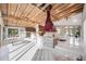 Open-concept living room with high wood ceilings, modern lighting, and access to outdoor spaces at 3636 Mineola, Sarasota, FL 34239