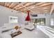 Spacious living room with an open floor plan, unique fireplace and access to the patio at 3636 Mineola, Sarasota, FL 34239