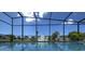 Relaxing screened pool with clear blue water and bright sky view, perfect for a refreshing swim at 3636 Mineola, Sarasota, FL 34239