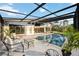 Inviting covered patio with pool access, comfortable seating, and a relaxing outdoor ambiance at 3636 Mineola, Sarasota, FL 34239