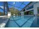 Inviting screened-in swimming pool with clear blue water and ample space for relaxation at 3636 Mineola, Sarasota, FL 34239