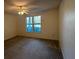 Bright bedroom with neutral walls, carpeted floors, and a ceiling fan for added comfort at 4002 Crockers Lake Blvd # 11, Sarasota, FL 34238