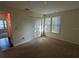 Bedroom featuring neutral carpet, window with blinds offering natural light, and a closet at 4002 Crockers Lake Blvd # 11, Sarasota, FL 34238