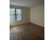 Comfortable bedroom with neutral carpet and a window with blinds offering ample natural light at 4002 Crockers Lake Blvd # 11, Sarasota, FL 34238