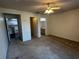 Spacious bedroom with carpeted floors leading to kitchen and bathroom for easy access at 4002 Crockers Lake Blvd # 11, Sarasota, FL 34238