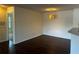 Bright dining room featuring modern light fixture and dark hardwood floors perfect for entertaining guests at 4002 Crockers Lake Blvd # 11, Sarasota, FL 34238