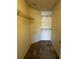 This walk-in closet features carpeted floors and multiple built-in wire shelves for optimal organization at 4002 Crockers Lake Blvd # 11, Sarasota, FL 34238