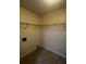 Spacious walk-in closet with wire shelving and neutral paint, providing ample storage space at 4002 Crockers Lake Blvd # 11, Sarasota, FL 34238