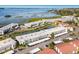 Stunning aerial view of condos near waterfront, featuring lush green spaces and convenient parking areas at 4414 Mount Vernon Dr # 1, Bradenton, FL 34210