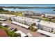 An aerial view of a condo community shows serene landscaping and a waterfront view at 4414 Mount Vernon Dr # 1, Bradenton, FL 34210