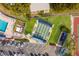 Aerial view of shuffleboard courts, pool, parking and manicured landscaping in this amenity-rich community at 4414 Mount Vernon Dr # 1, Bradenton, FL 34210
