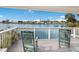 Inviting balcony with comfortable chairs overlooking a scenic lake, perfect for enjoying waterfront views at 4414 Mount Vernon Dr # 1, Bradenton, FL 34210