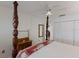 Bright bedroom showcases a wooden four-poster bed and natural lighting at 4414 Mount Vernon Dr # 1, Bradenton, FL 34210
