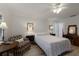 Well-lit bedroom with a comfortable bed, neutral decor, and a cozy seating area for relaxation at 4414 Mount Vernon Dr # 1, Bradenton, FL 34210
