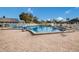 Inviting community pool surrounded by lounge chairs and lush landscaping at 4414 Mount Vernon Dr # 1, Bradenton, FL 34210