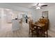 Cozy dining area adjacent to the kitchen, featuring a wooden table, chairs and light-colored floors at 4414 Mount Vernon Dr # 1, Bradenton, FL 34210