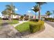 A charming building entrance showcases a fountain and colorful landscaping, providing curb appeal at 4414 Mount Vernon Dr # 1, Bradenton, FL 34210