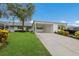 Inviting single story home with a covered carport, manicured lawn, and bright, airy feel at 4414 Mount Vernon Dr # 1, Bradenton, FL 34210